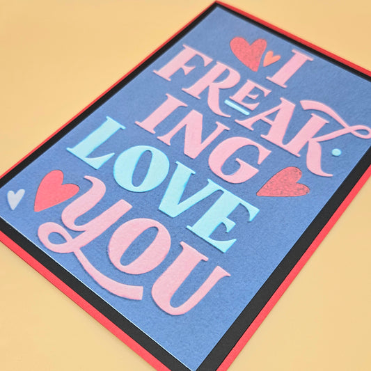 Card with 'I FREAKING LOVE YOU' text on a blue background