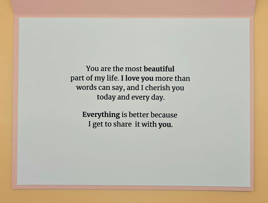 Card with romantic message on a plain background