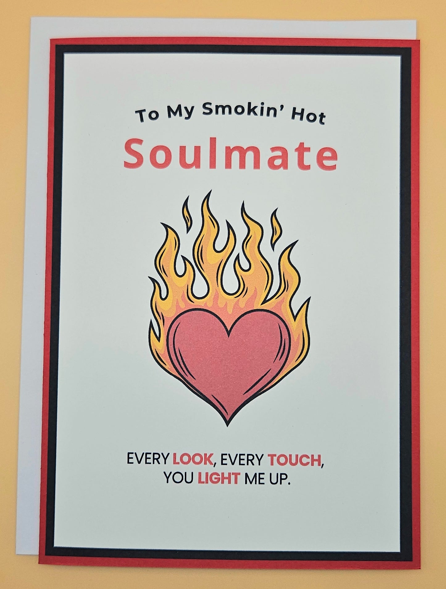 Card with flaming heart design and text 'To My Smokin' Hot Soulmate' on a beige background