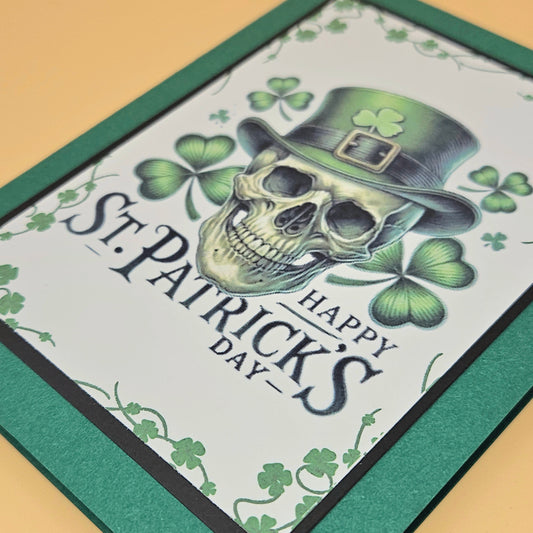 St. Patrick's Day card with a skull wearing a green hat and shamrocks.