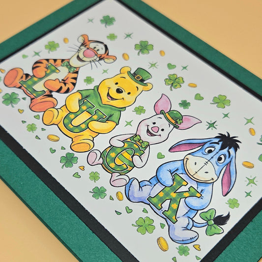 St. Patrick's Day-themed placemat with cartoon characters on a green border.