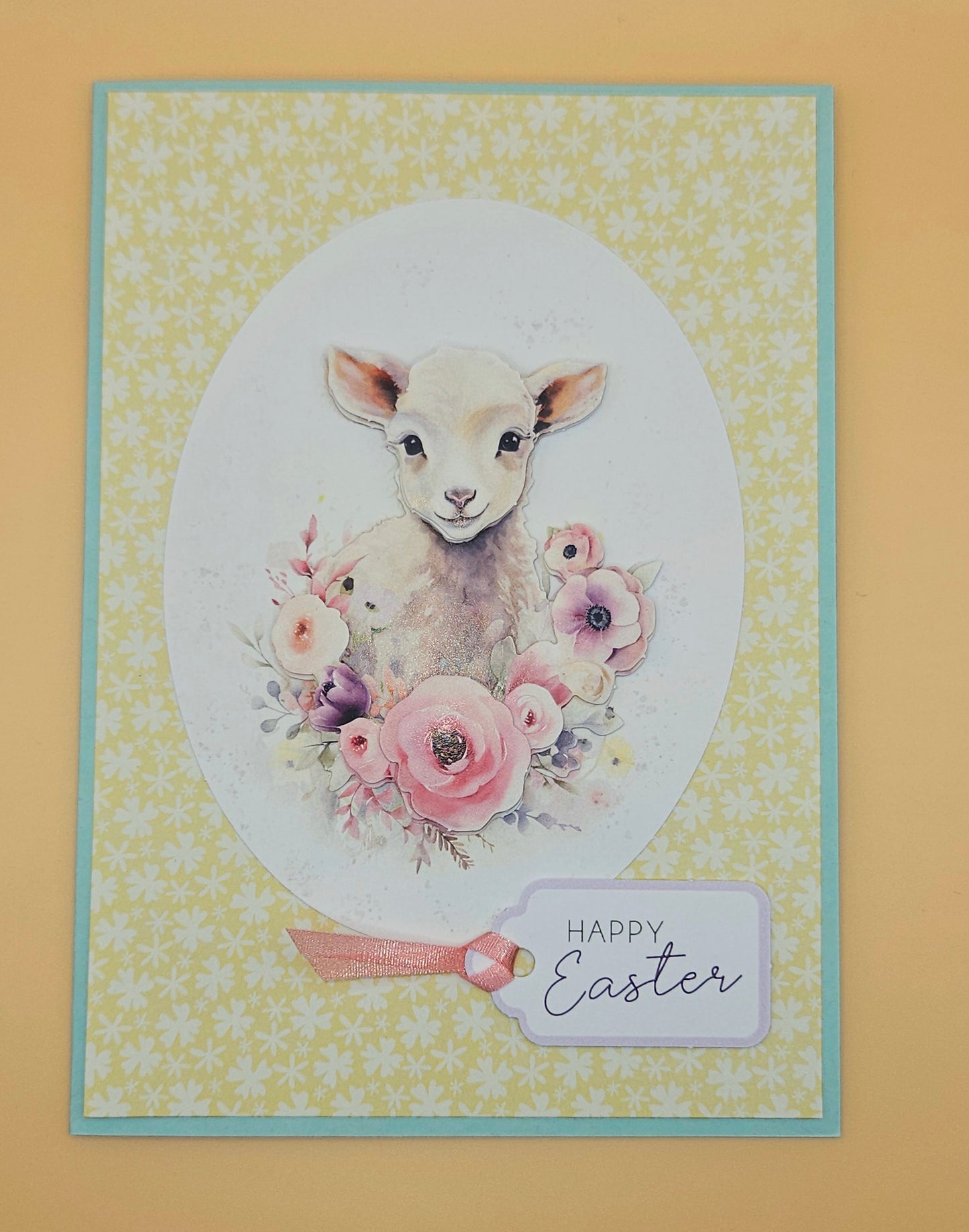 Easter card with a lamb and flowers on a yellow background
