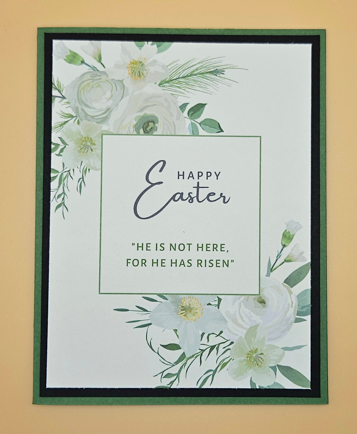 Framed Easter card with floral design and text on a beige background