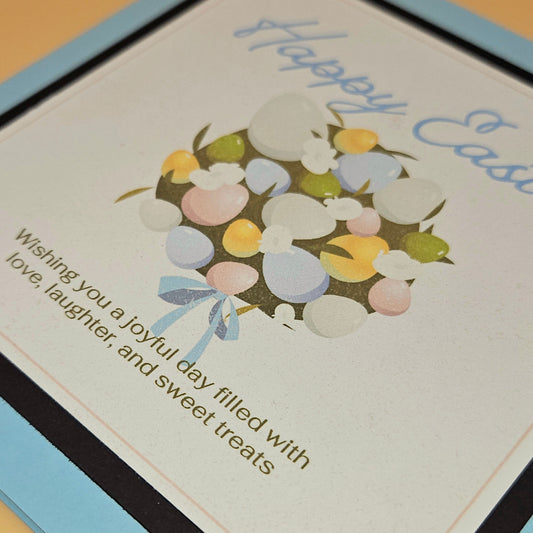 Easter card with colorful eggs and a bow, featuring a message.