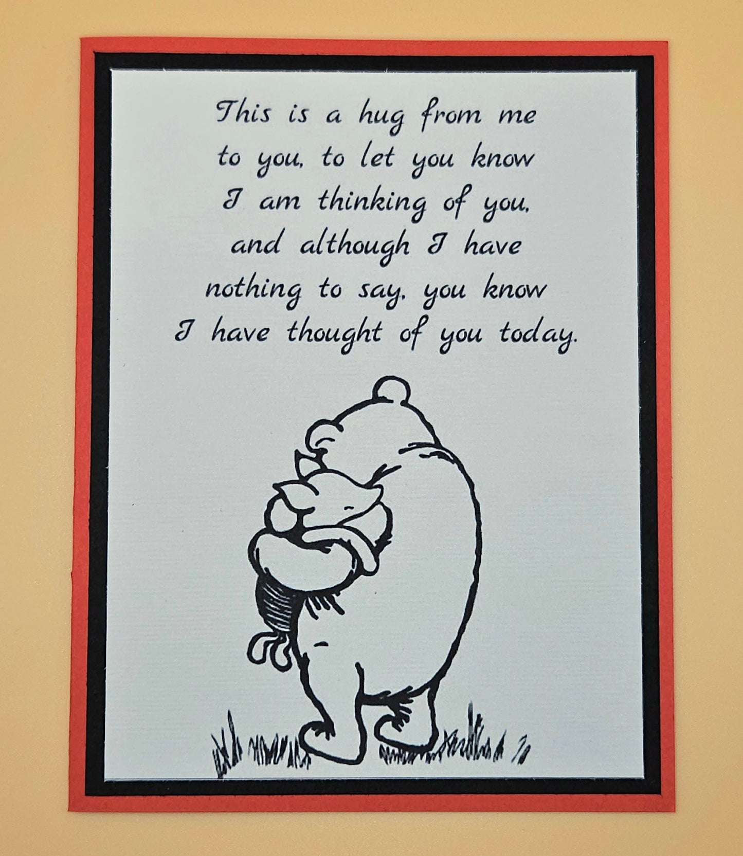 Card with a bear hugging a heart and text on a beige background
