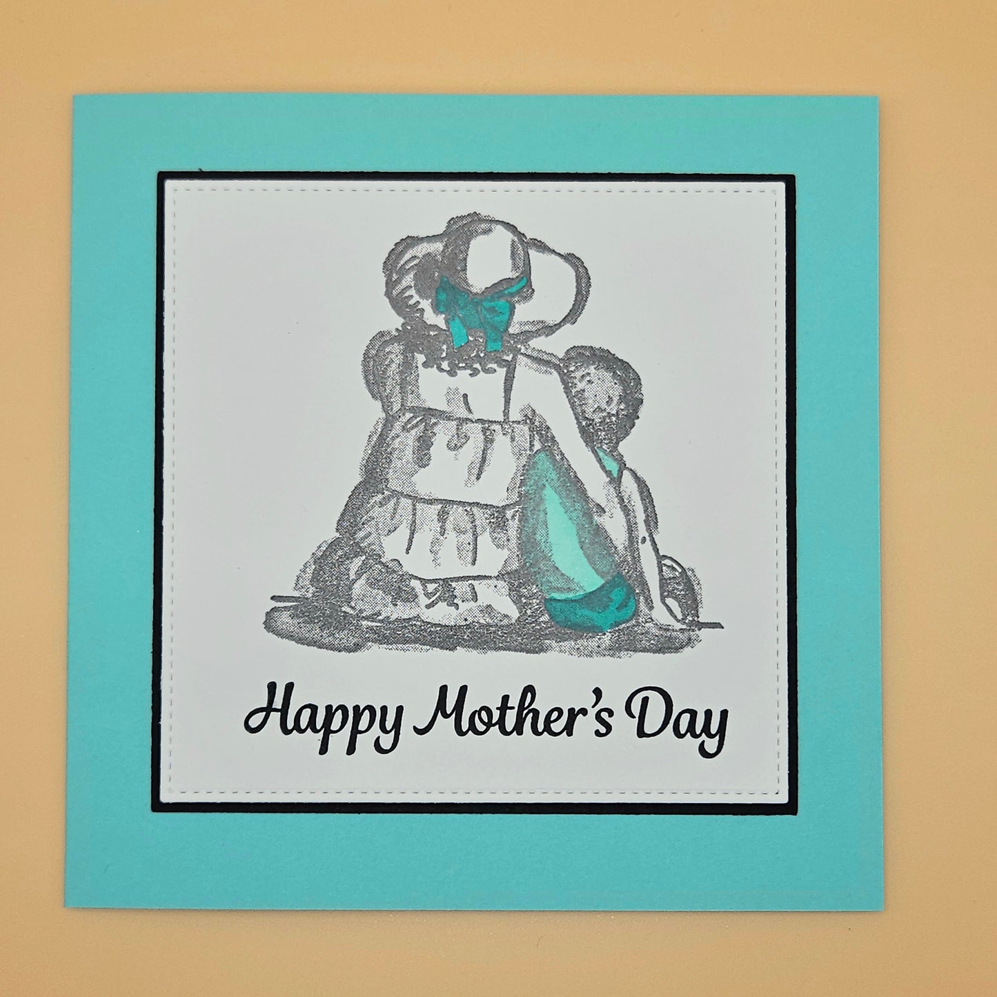 Mother's Day card with illustration of a woman and text on a teal border