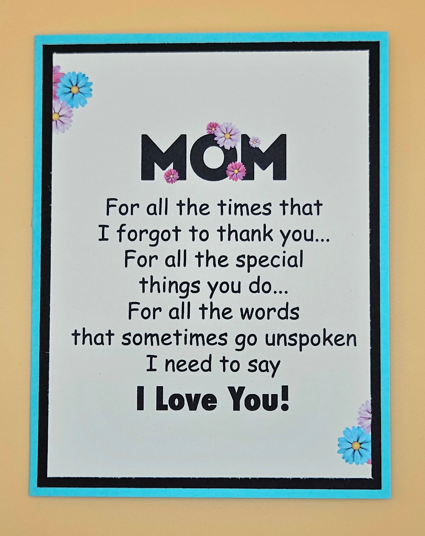 Card with a message to 'Mom' expressing gratitude and love on a beige background