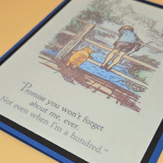 Illustration of a boy and bear on a bridge with a quote underneath.