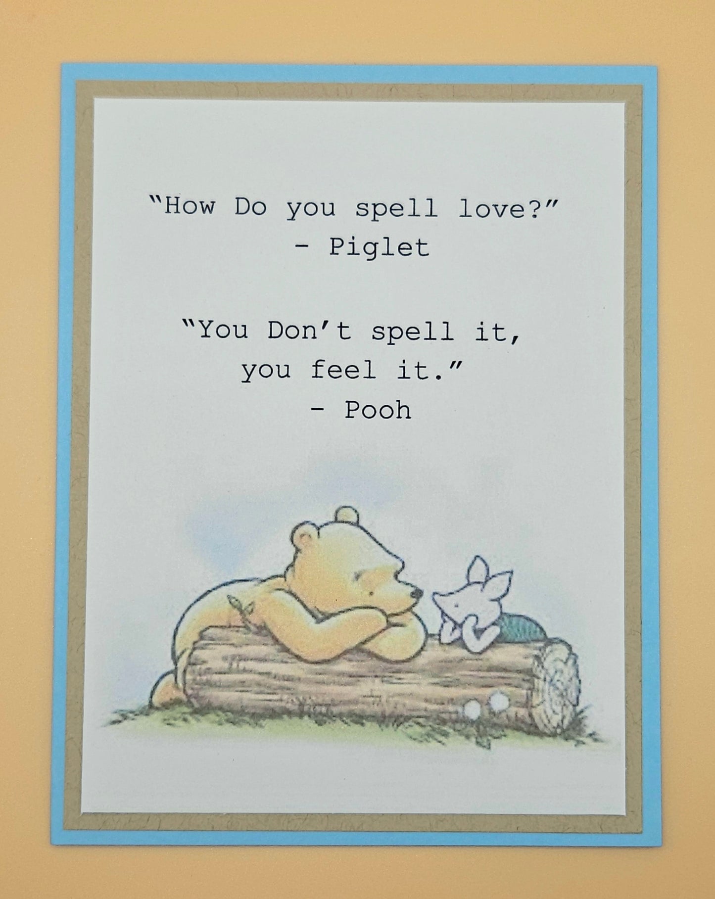 Cartoon of Pooh and Piglet on a log with a quote about love.