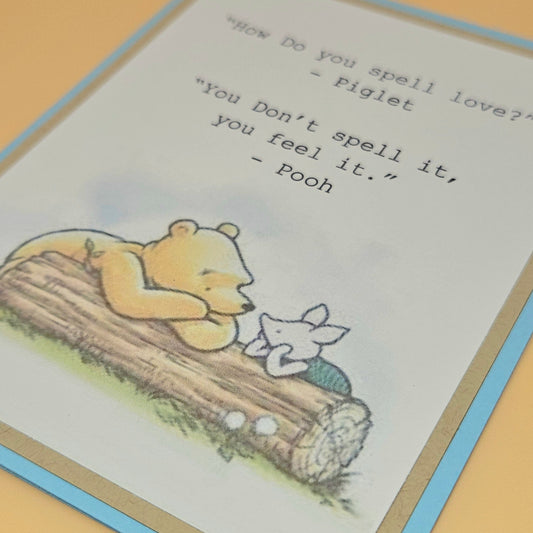 Cartoon of Pooh and Piglet on a log with a quote about love.