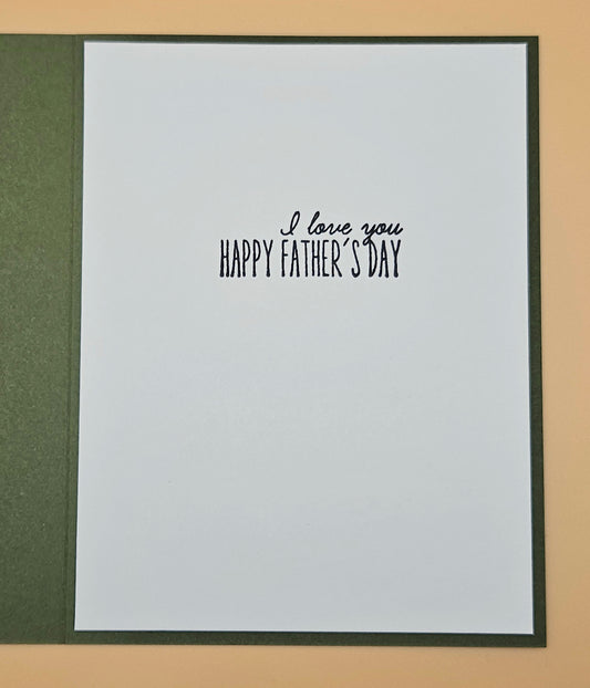 Framed card with 'I love you Happy Father's Day' text on a beige background