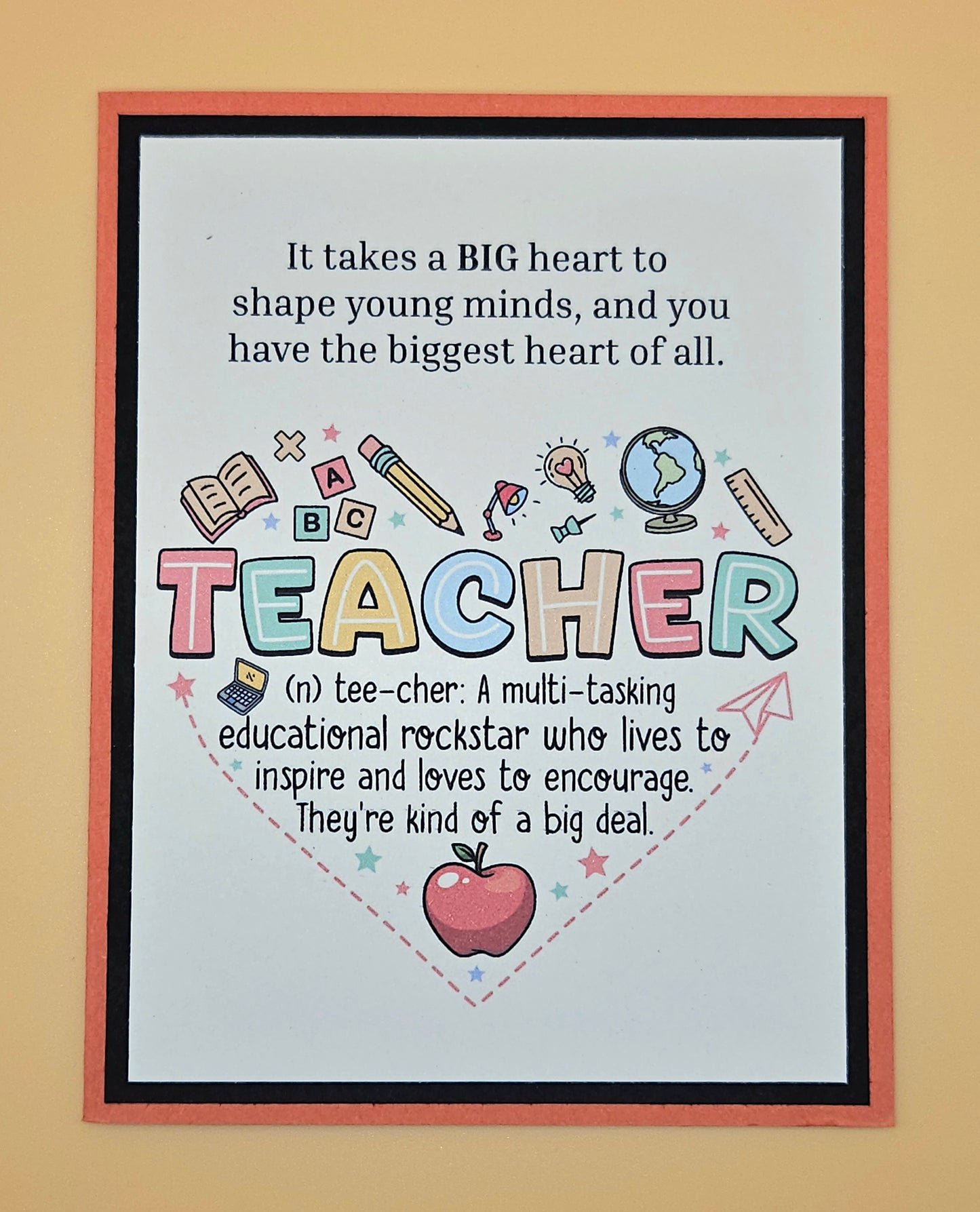 Framed poster with colorful text and graphics about teachers on a beige background