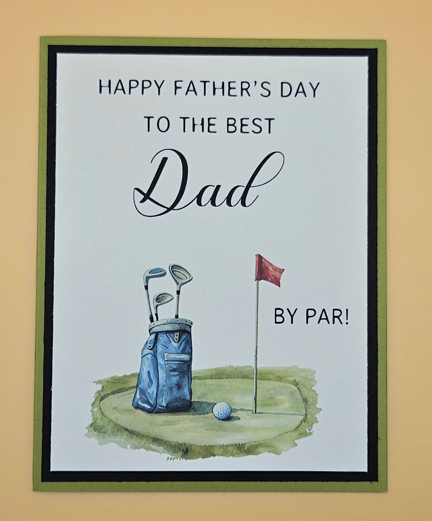 Framed Father's Day card with golf-themed illustration and text on a beige background