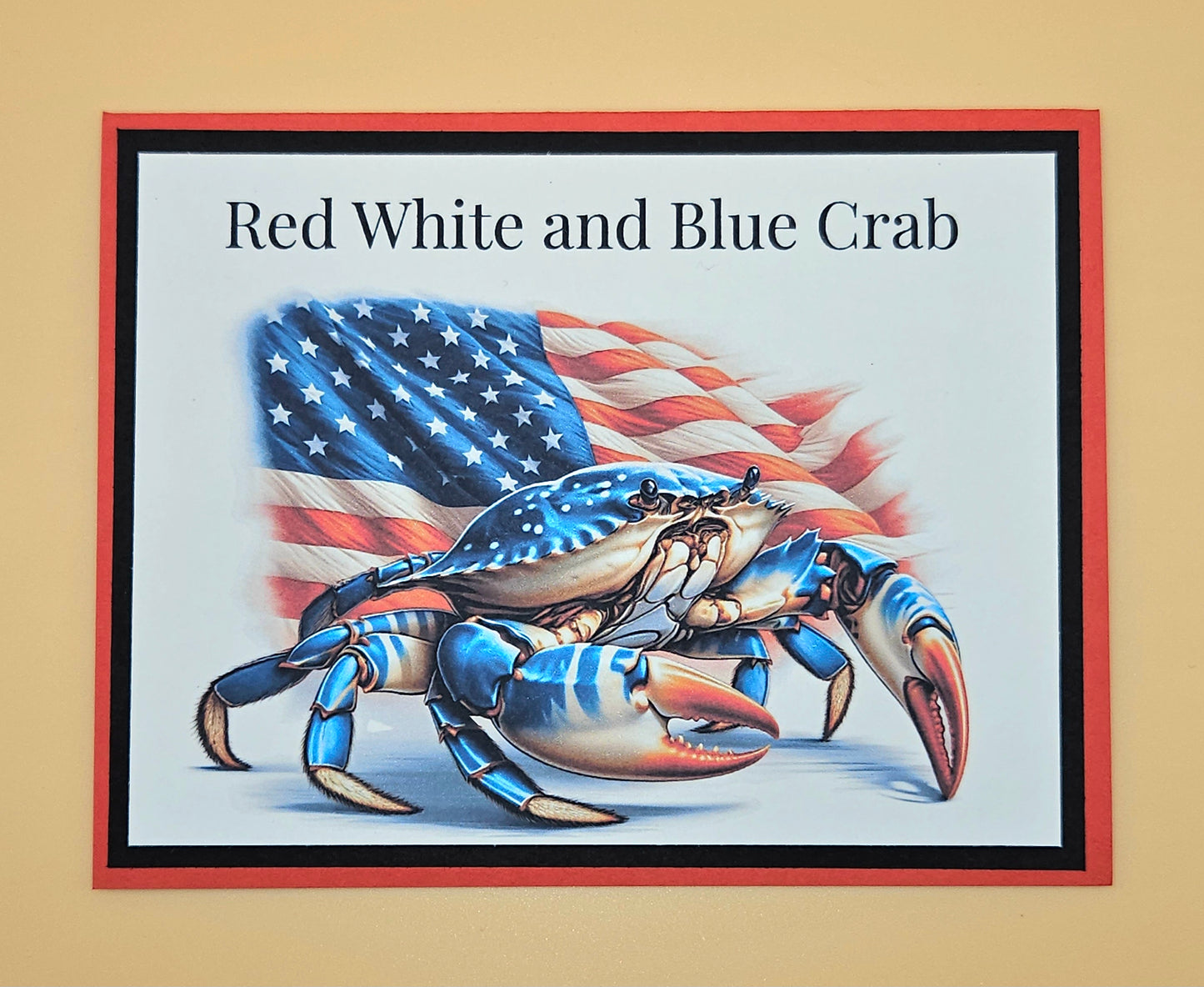 Framed artwork of a crab with red, white, and blue colors on a beige background