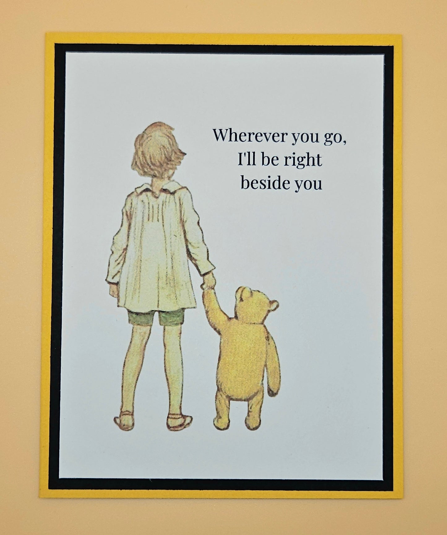 Handmade Winnie the Pooh friendship card featuring classic Christopher Robin and Pooh walking hand in hand illustration with warm yellow and black layered cardstock frames