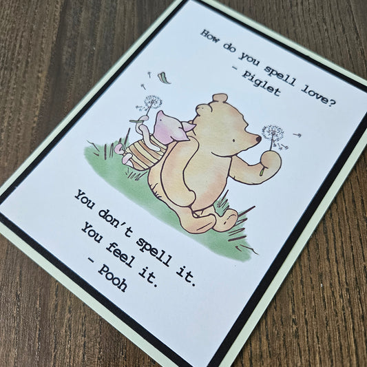 Cartoon bear and piglet illustration with text on a wooden surface