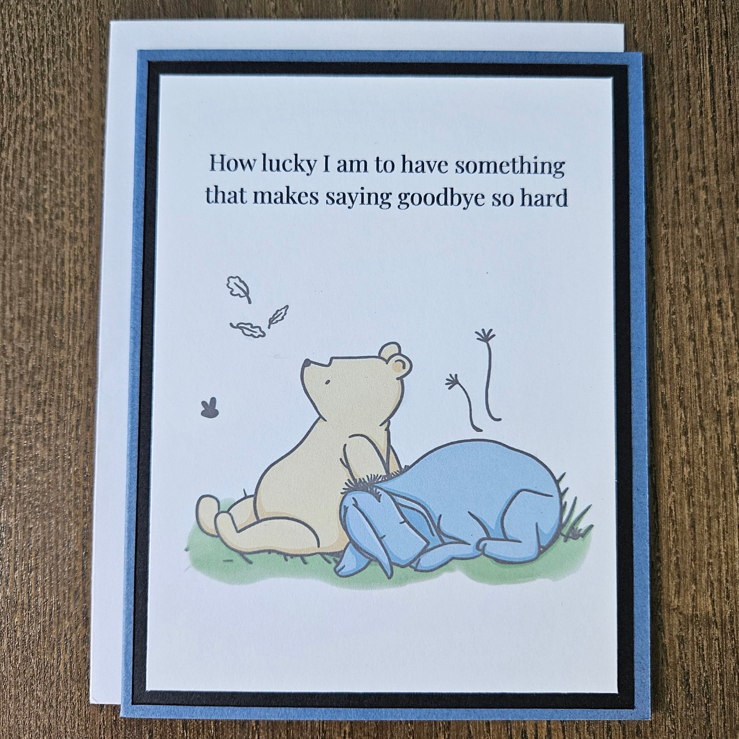 Handmade Winnie the Pooh goodbye card featuring an illustration of Pooh and Eeyore sitting together under falling autumn leaves next to the classic quote text banner.
