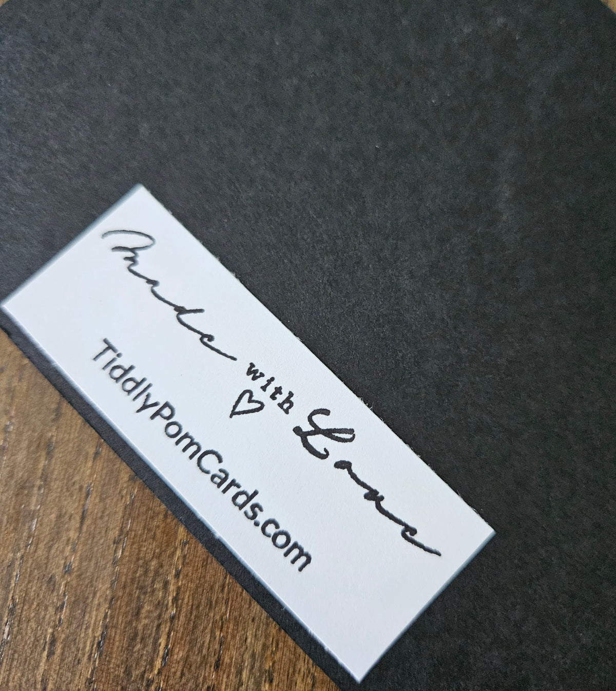 White card with black text on a dark surface