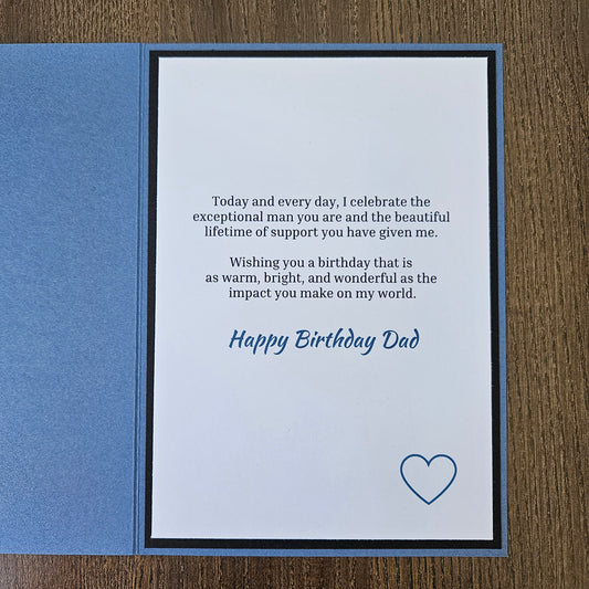 Inside panel of the 5x7 card displaying a printed birthday message in crisp black ink with Happy Birthday Dad in blue script, accented by a single blue heart outline in the lower right corner.