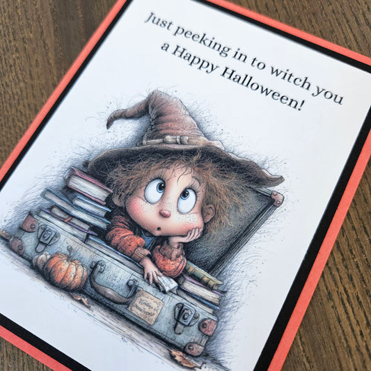 Close-up of whimsical young witch, spellbooks, pumpkin, and Happy Halloween pun sentiment
