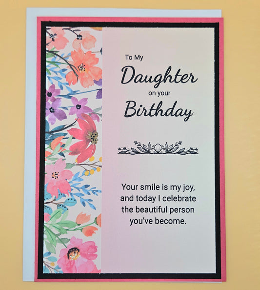 Birthday card for a daughter with floral design and birthday message.