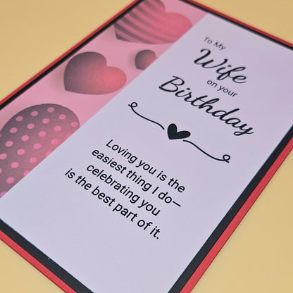 Birthday card for a wife with heart designs and text on a beige background