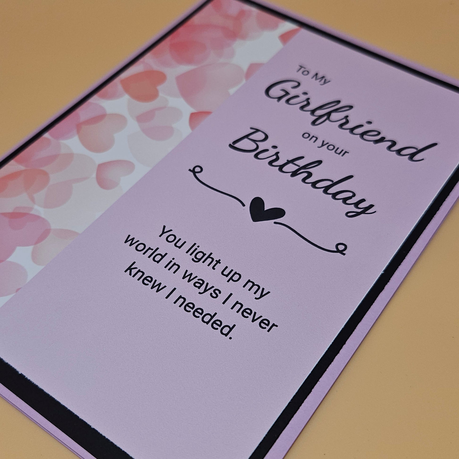 Greeting card for a girlfriend's birthday with heart design and text.