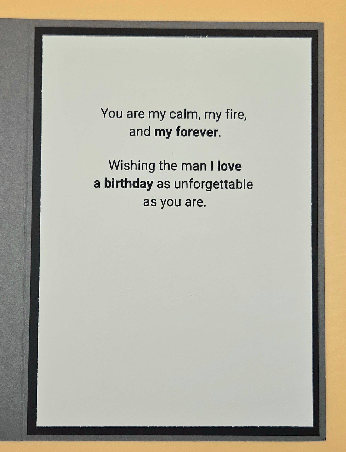 Framed text card with romantic message on a plain background