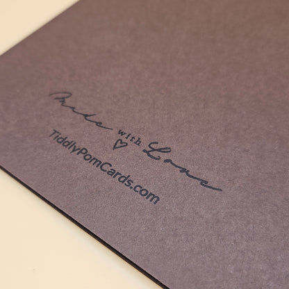 Brown card with 'Made with Love' and a website URL on a beige background