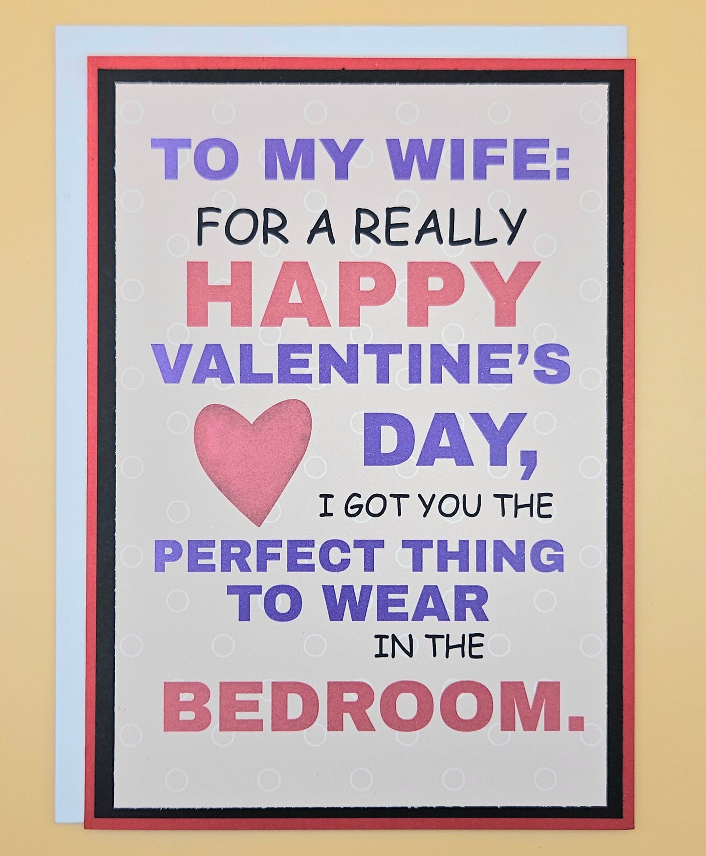 Valentine's Day card for a wife with humorous message and pink heart on beige background