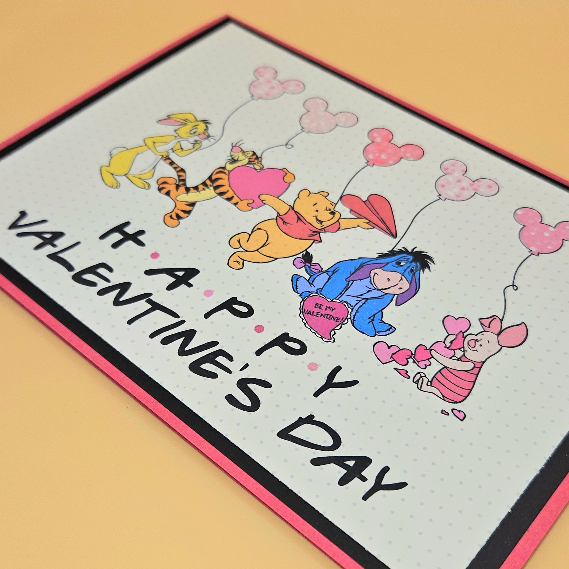 Valentine's Day card with cartoon characters and 'Happy Valentine's Day' text on a beige background.