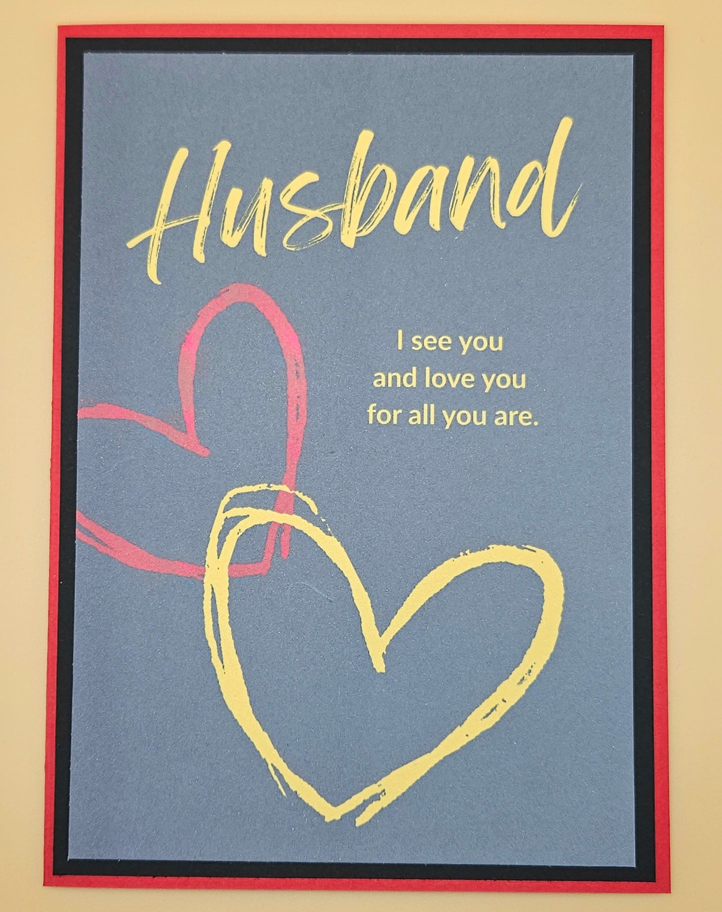 Card with 'Husband' text and heart design on a blue background