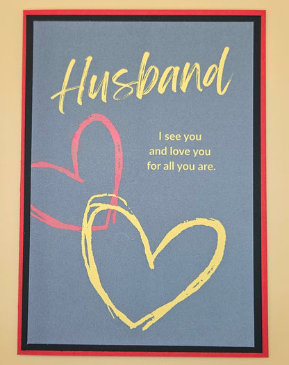 Card with 'Husband' text and heart design on a blue background