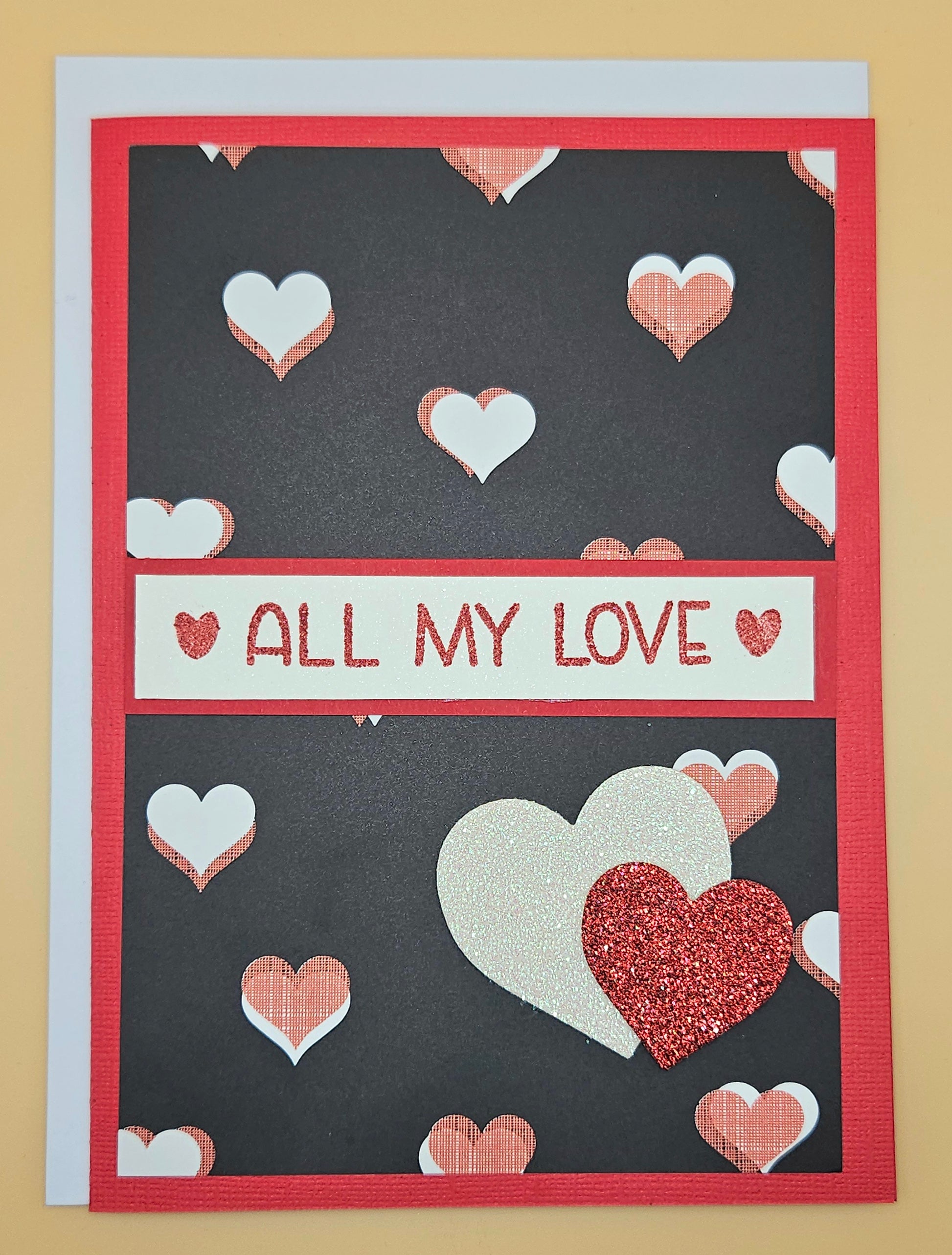 Greeting card with heart designs and 'All My Love' text on a dark background
