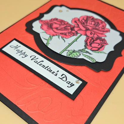Valentine's Day card with red roses and 'Happy Valentine's Day' text on an orange background.