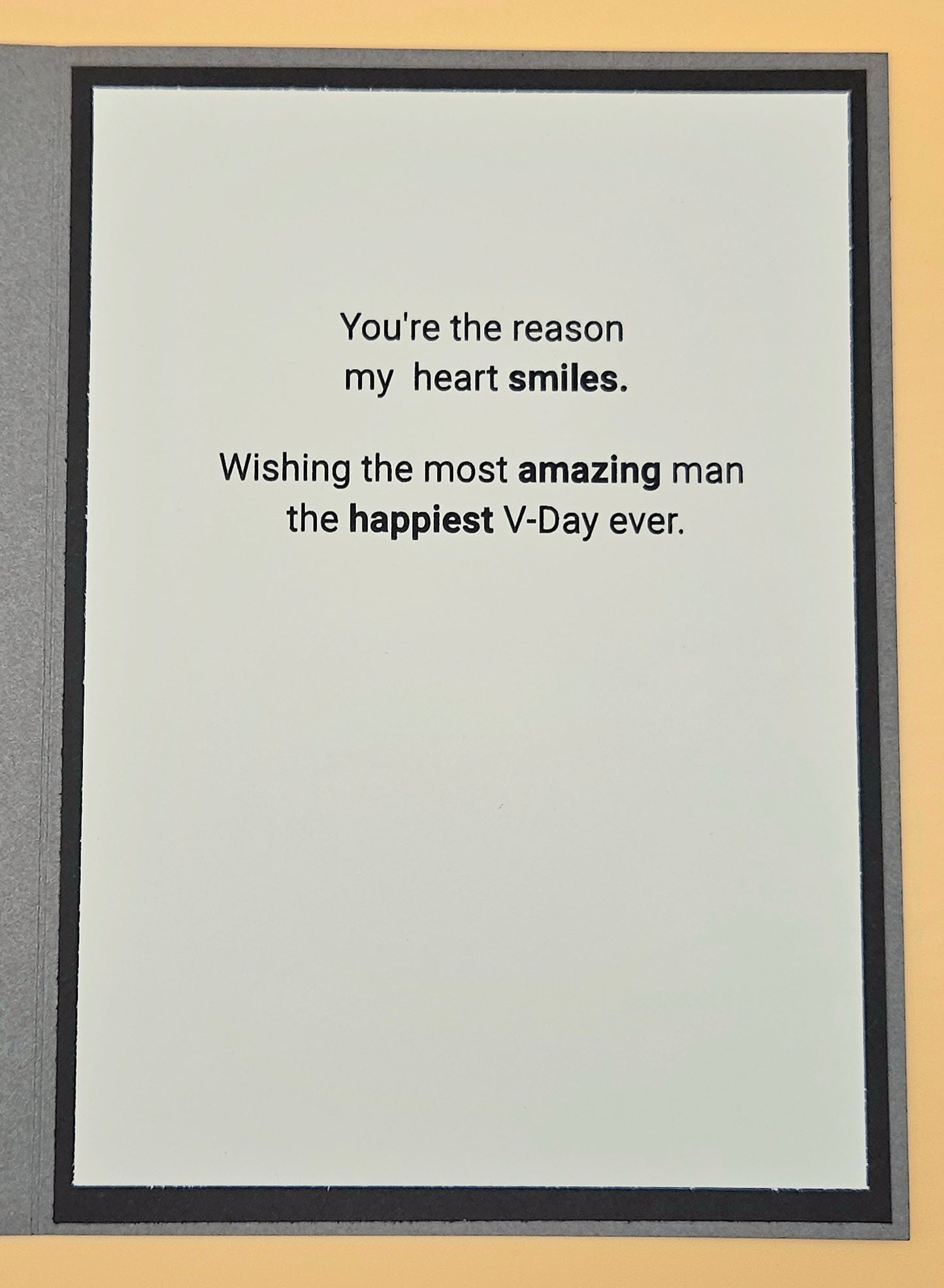 Framed card with Valentine's Day message on a beige background