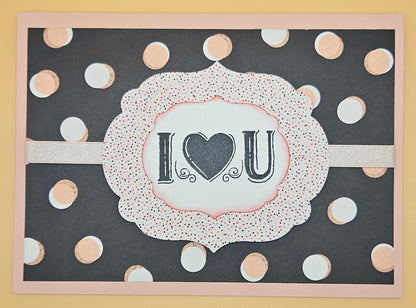 Card with 'I ❤️ U' text on a polka dot background