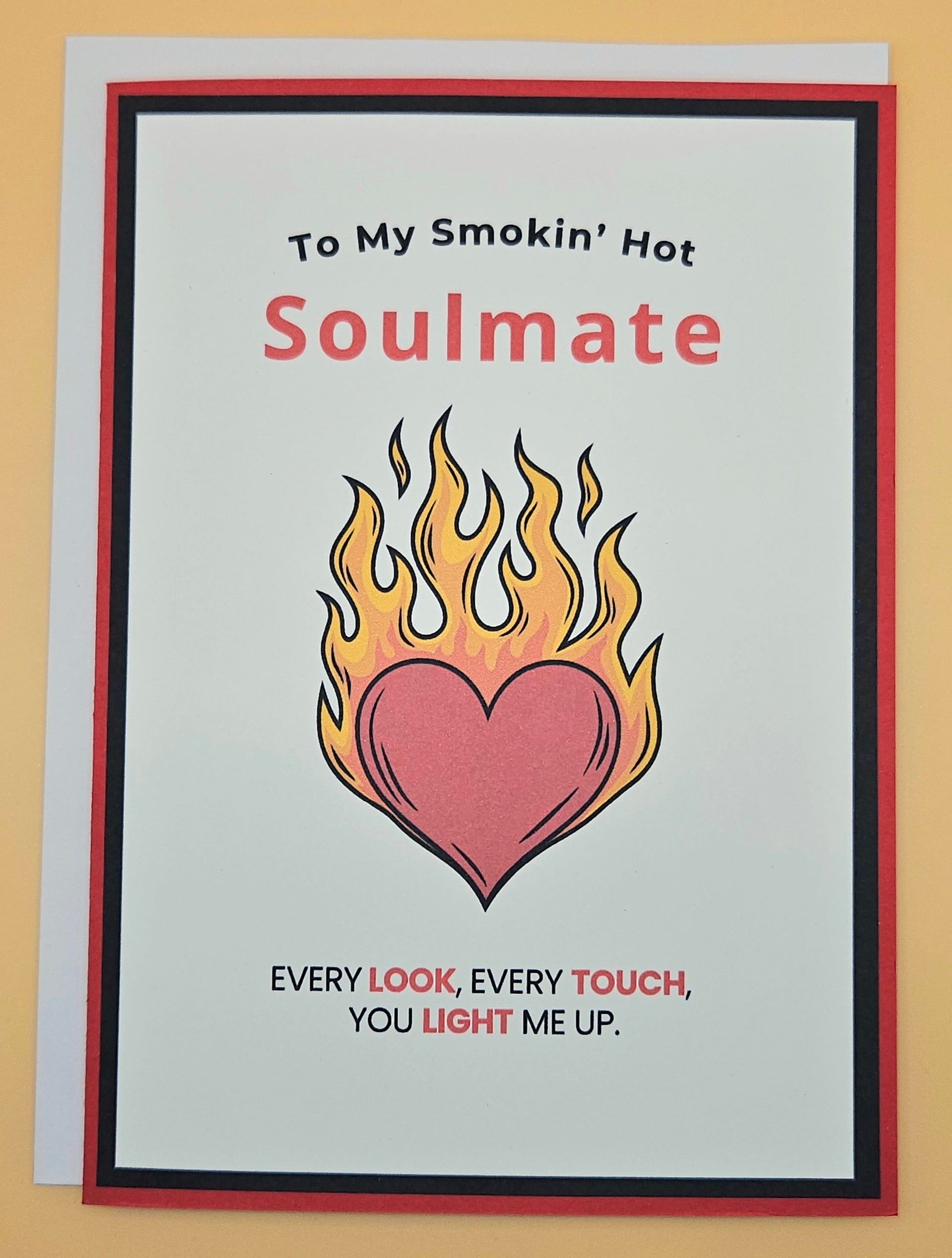 Card with flaming heart design and text 'To My Smokin' Hot Soulmate' on a beige background