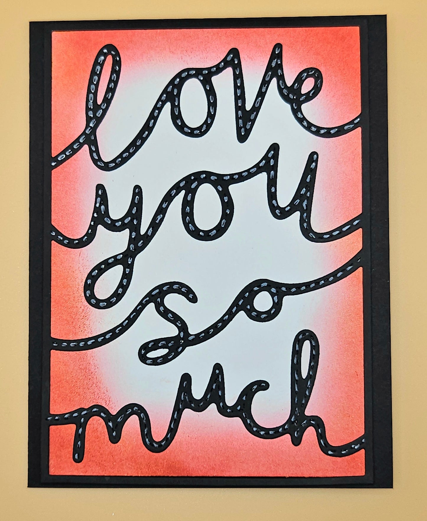 Decorative sign with 'love you so much' text on a gradient background