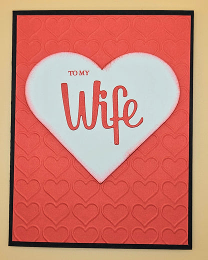 Card with a white heart on a red background, featuring the text 'To My Wife'.
