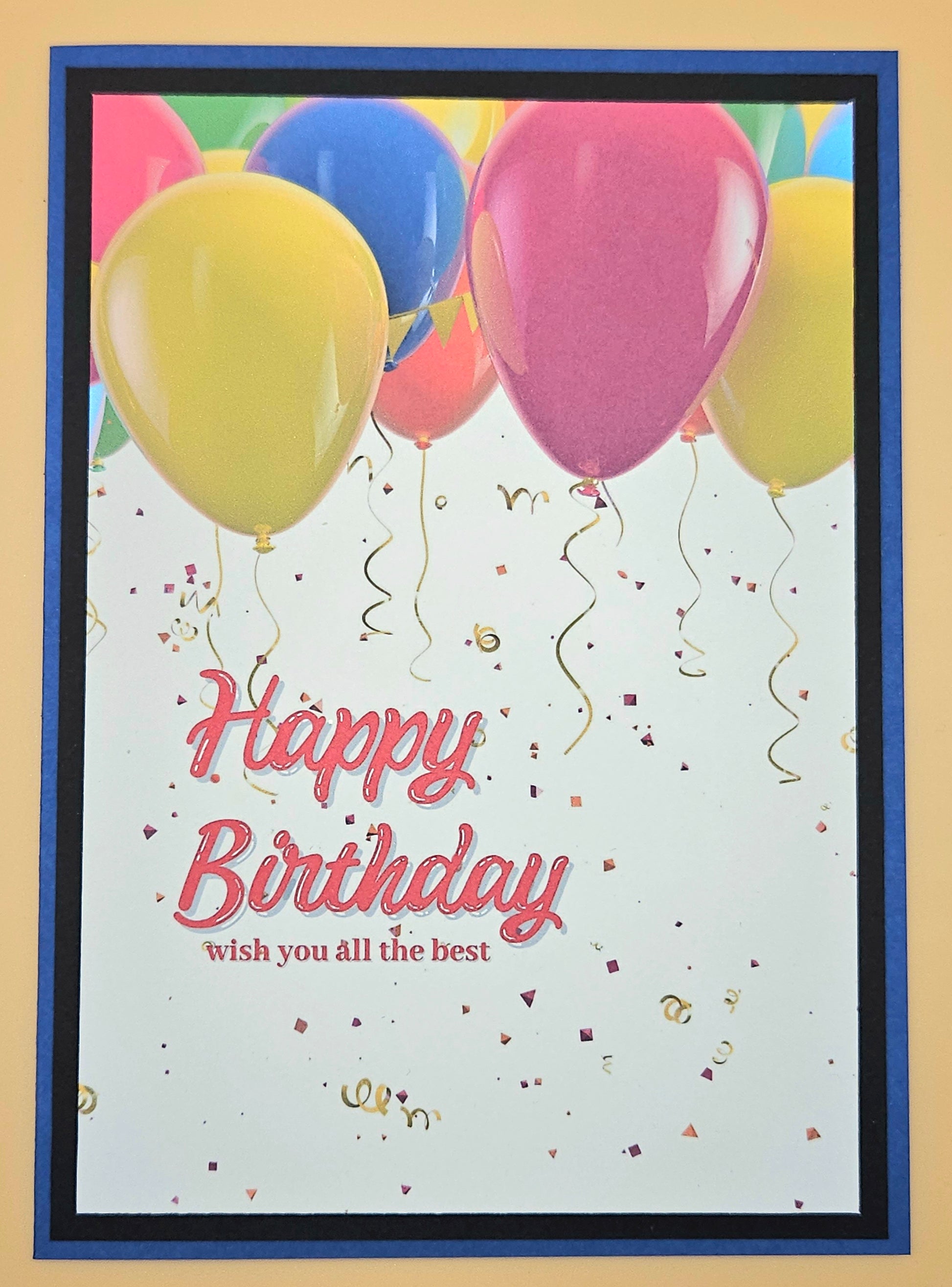 Birthday card with colorful balloons and 'Happy Birthday' text on a beige background