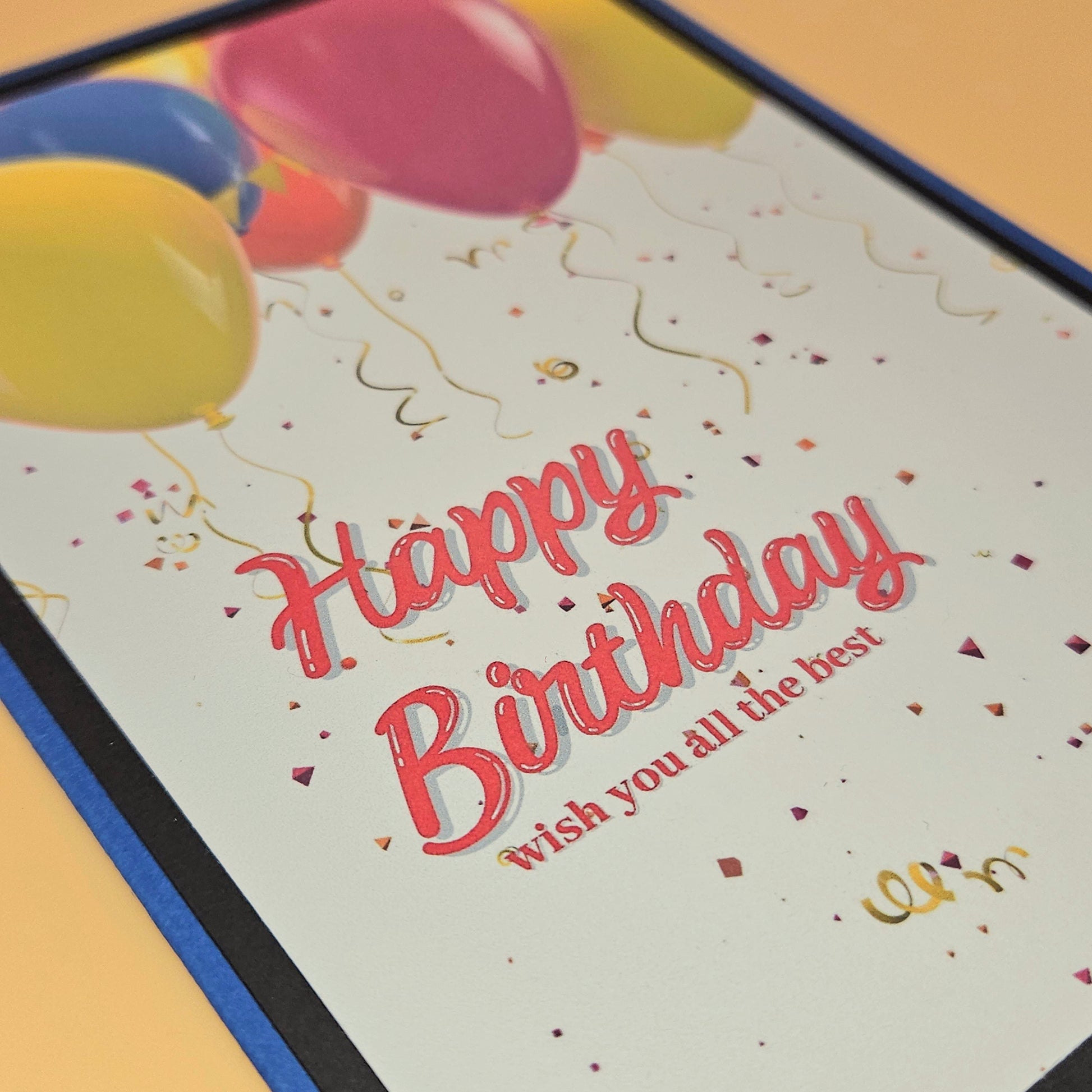 Birthday card with colorful balloons and text on a light background