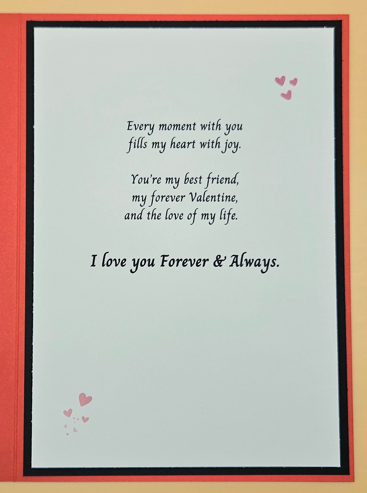 Card with romantic message and hearts on a beige background