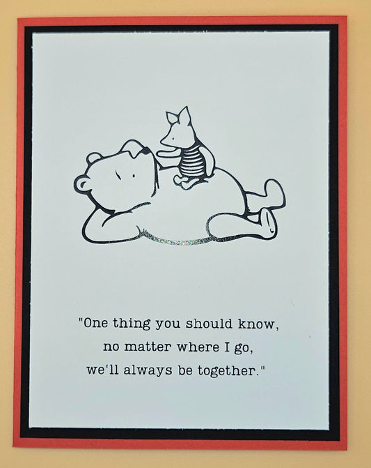 Cartoon illustration of a bear and a dog lying down with a quote on a light blue background.