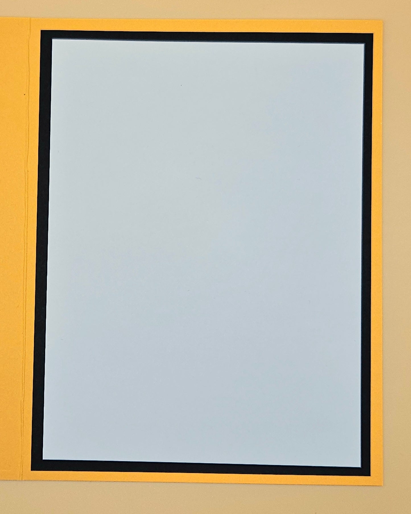 Clear window with black frame on a yellow background