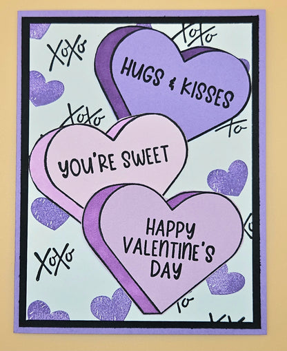 Valentine's Day card with purple hearts and text on a light blue background