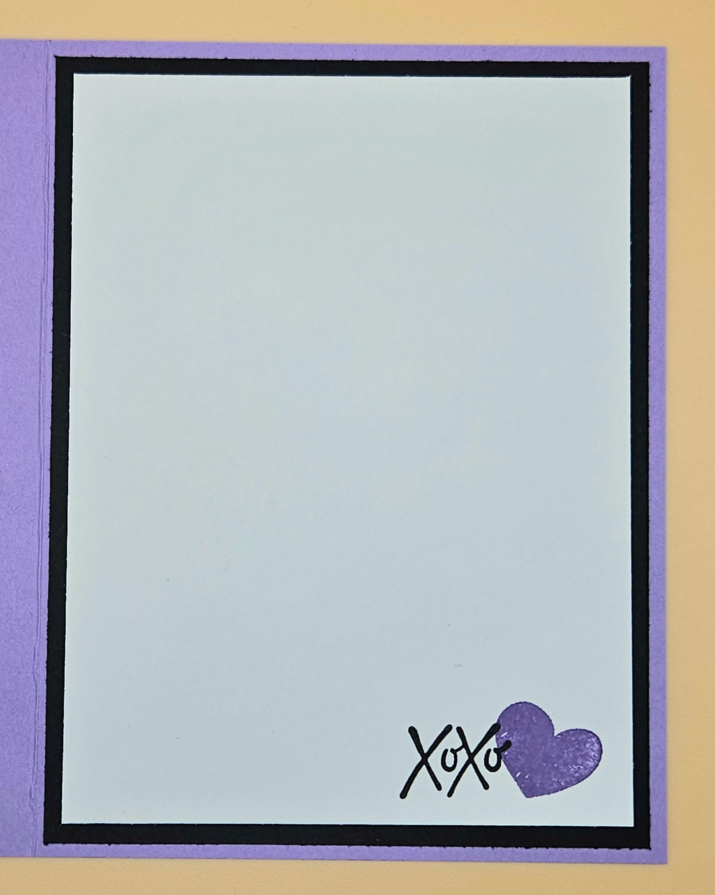 Note card with 'XOXO' and a heart stamp on a purple border