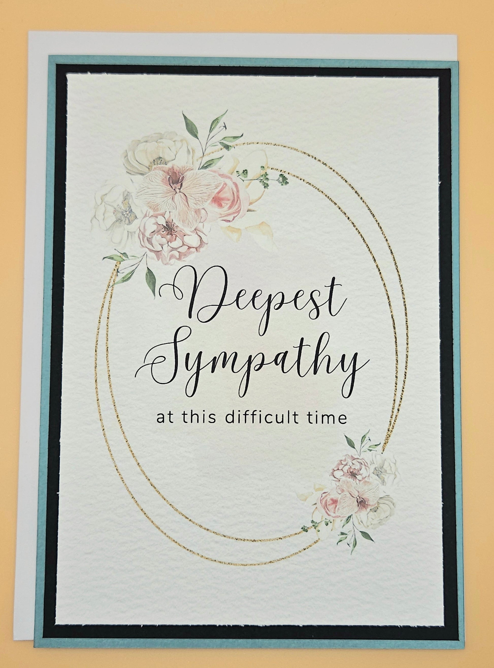 Sympathy card with floral design and 'Deepest Sympathy' text on a beige background