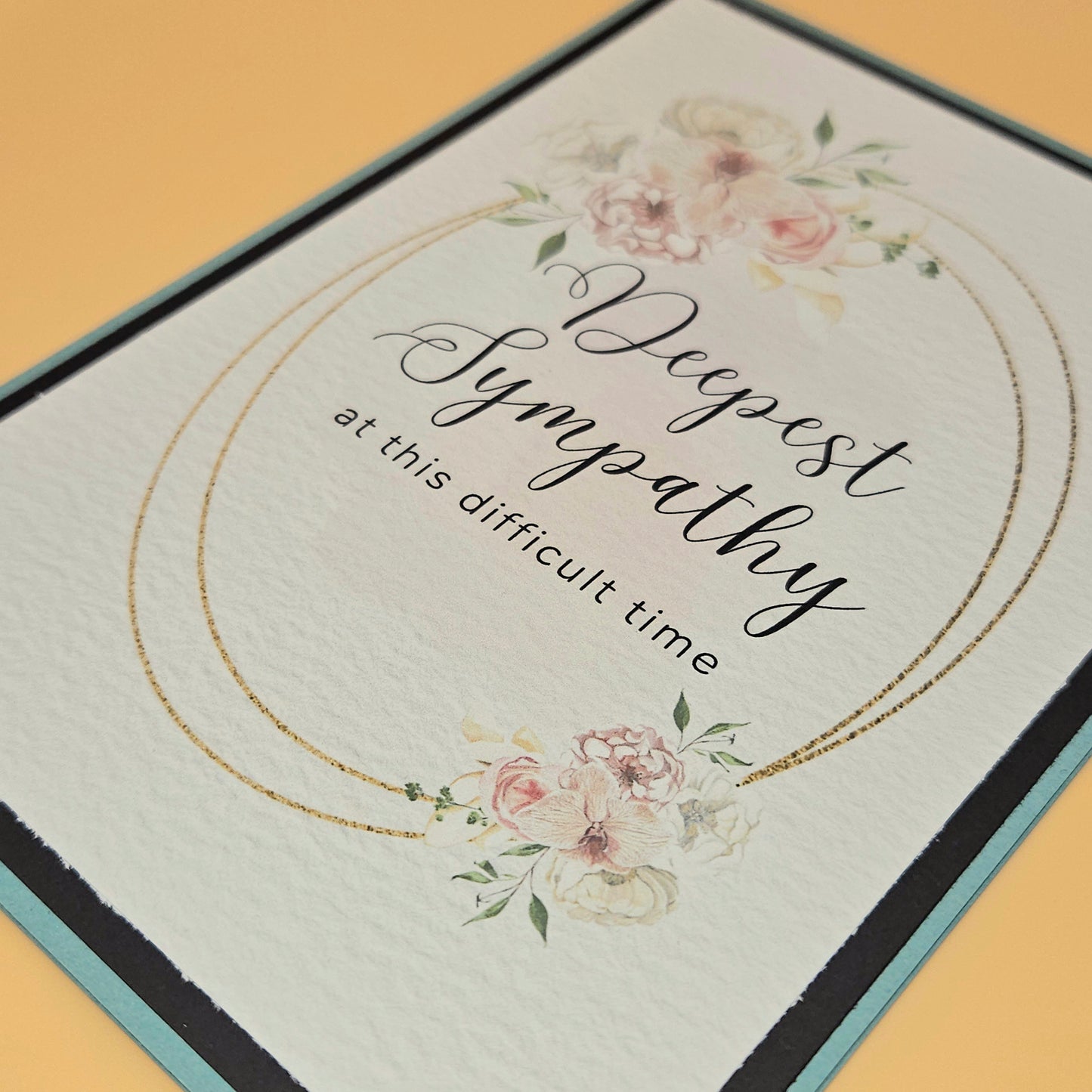 Sympathy card with floral design and text on a yellow background