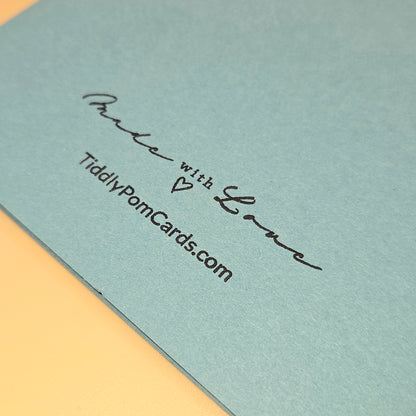 Light blue card with 'Made with Love' and 'TiddlyPomCards.com' text on a yellow border.